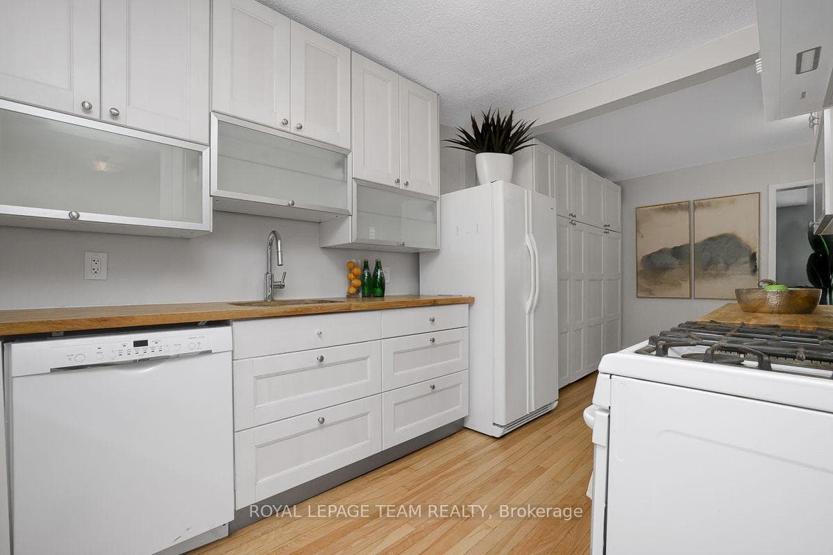 Galley kitchen with tons of cabinetry