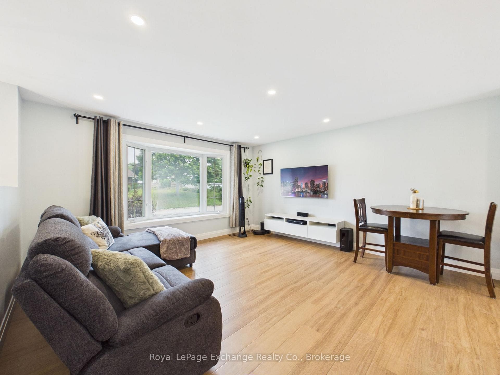 Living room w/ large bay window