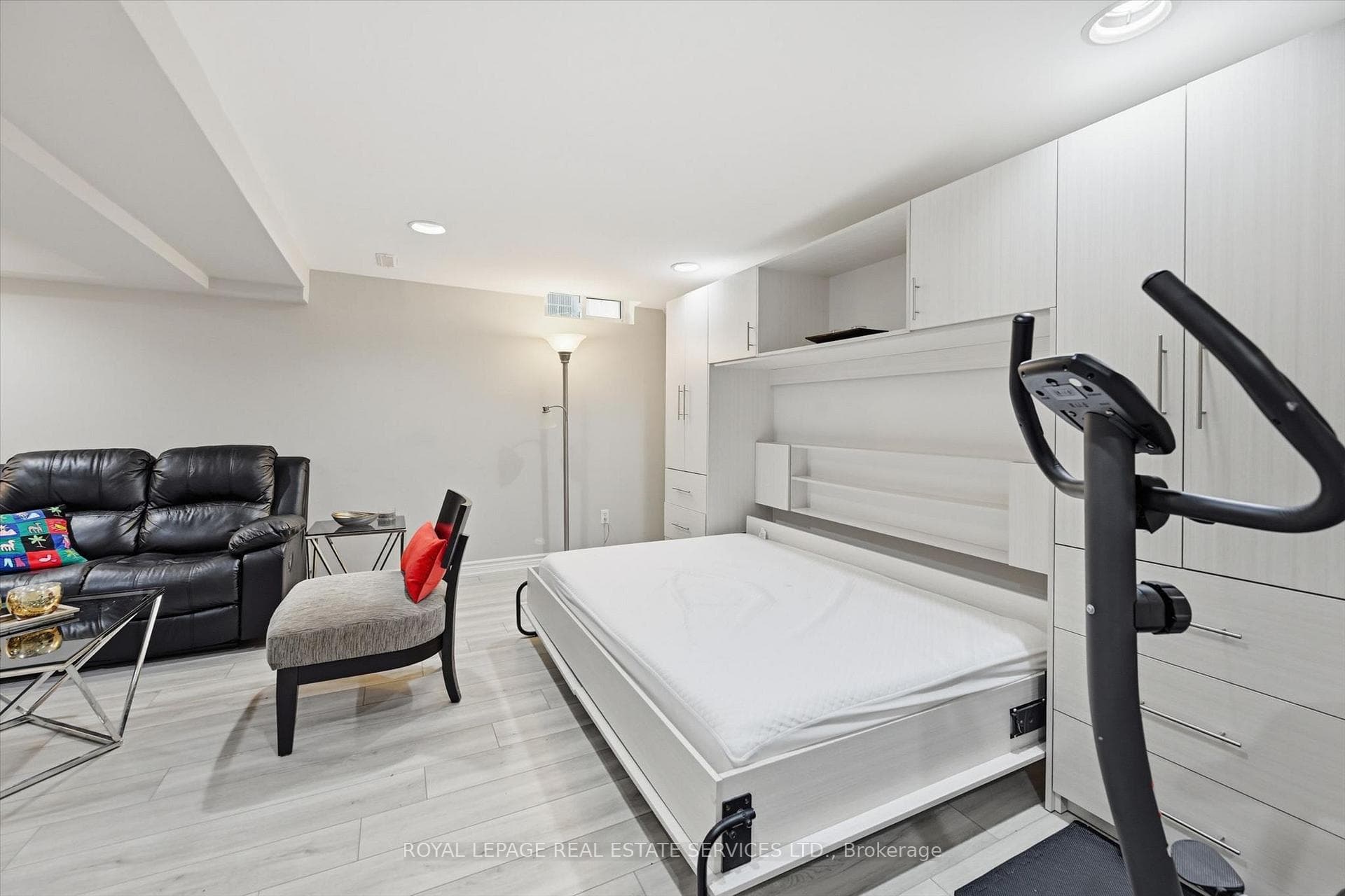 Built-in Murphy Bed Framed by Custom Cabinetry
