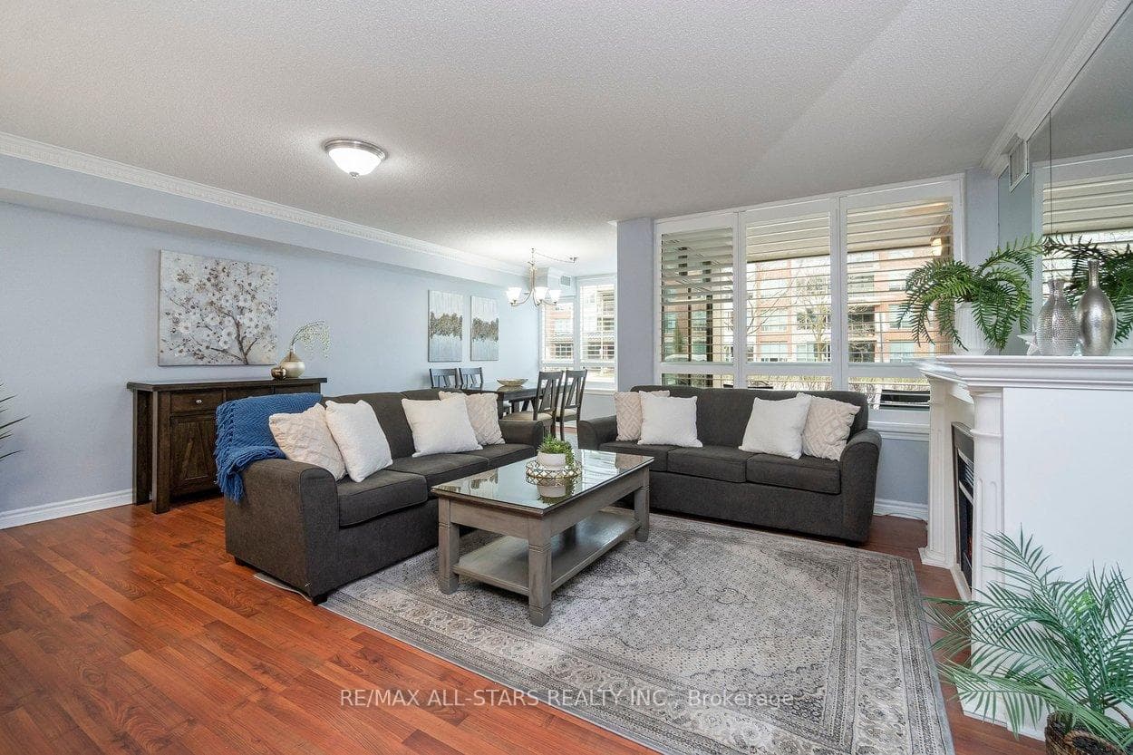 Open concept living, dining & sun room areas.