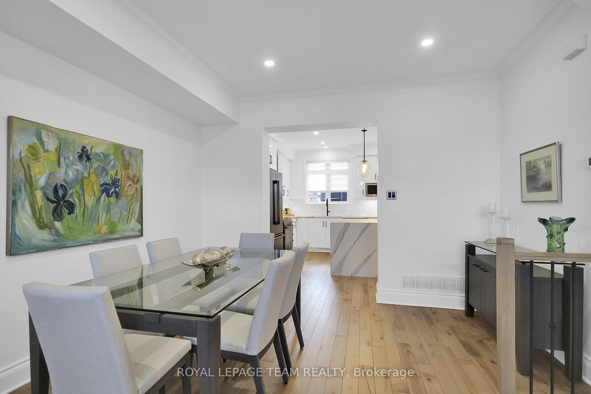 Warm hardwood floors flow throughout the home