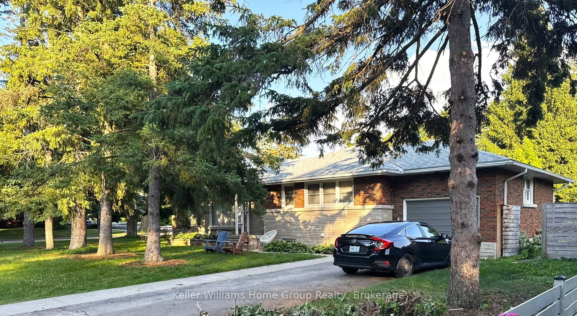 Front of home and driveway in summer