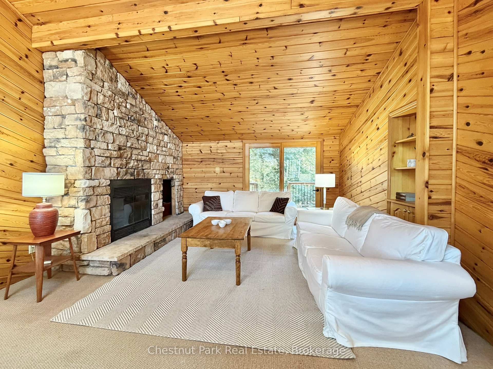 Great room with double glass doors to basic deck