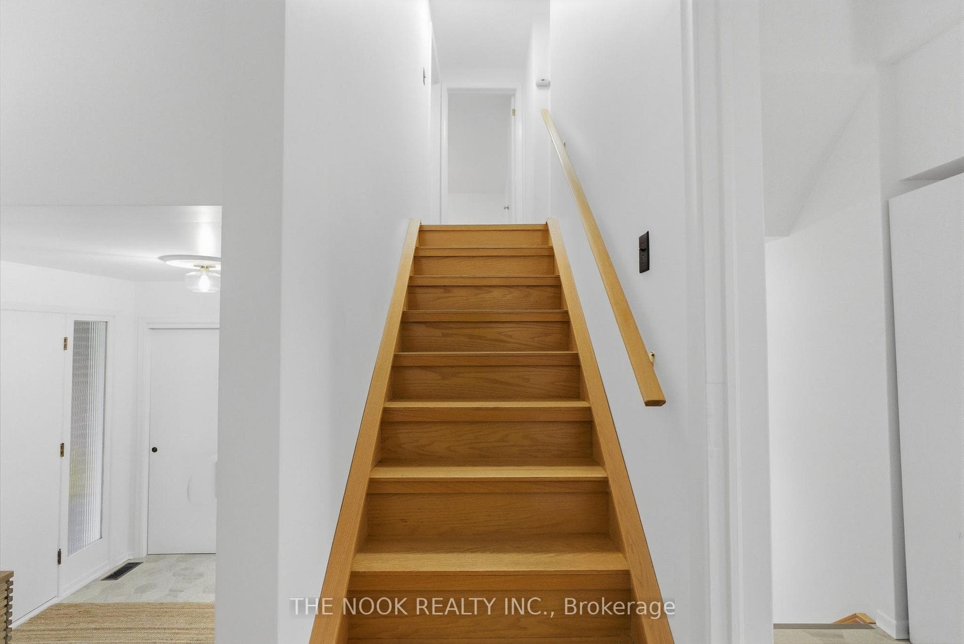 Hardwood stairs up to the bedrooms