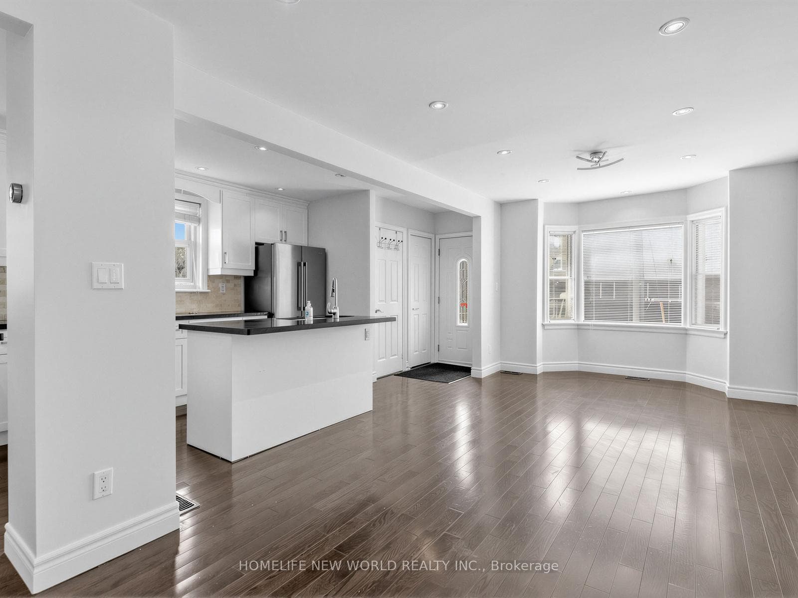 Open concept kitchen/living space with sunlight!