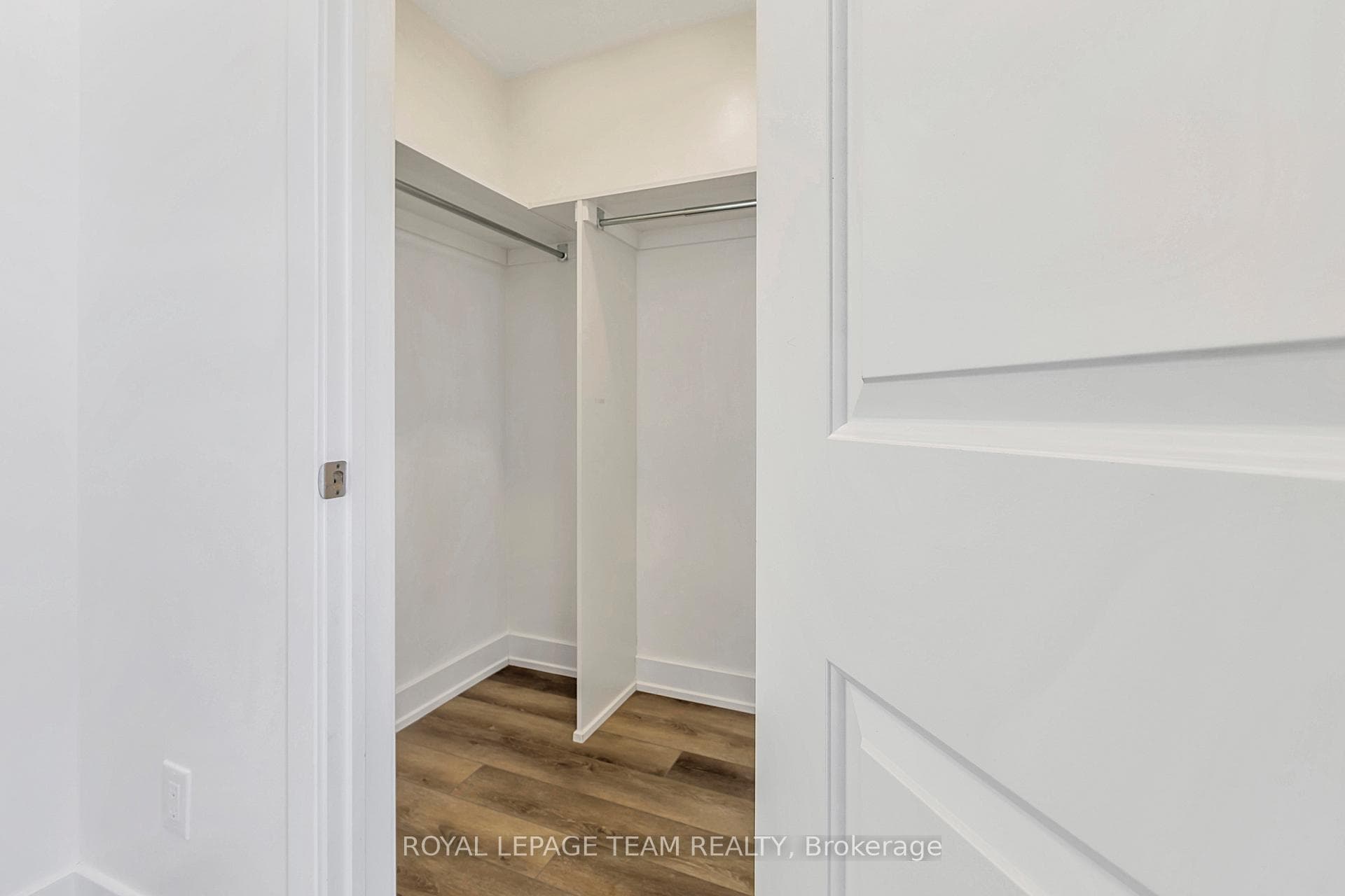 Primary bedroom walk in closet