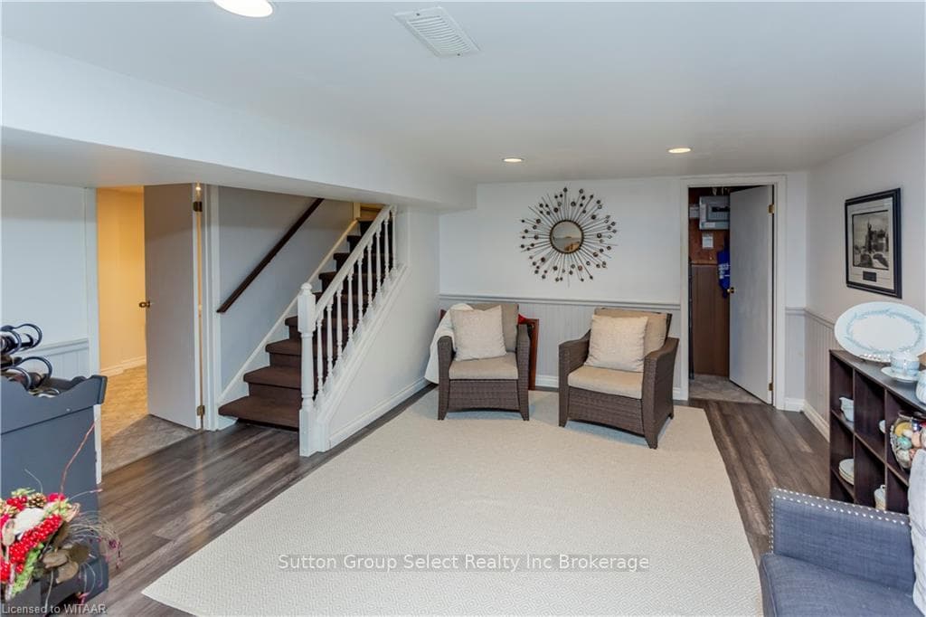 Living area featuring dark wood-type flooring