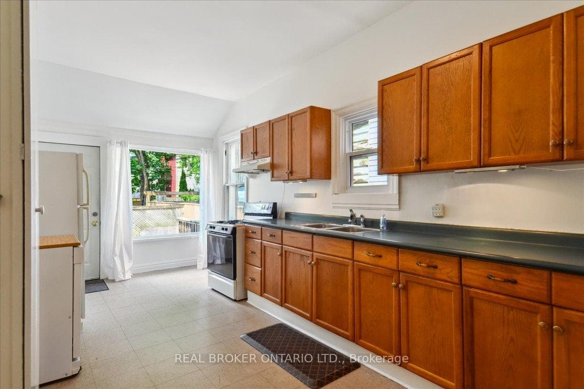 Large Kitchen with large windows and walk-out deck