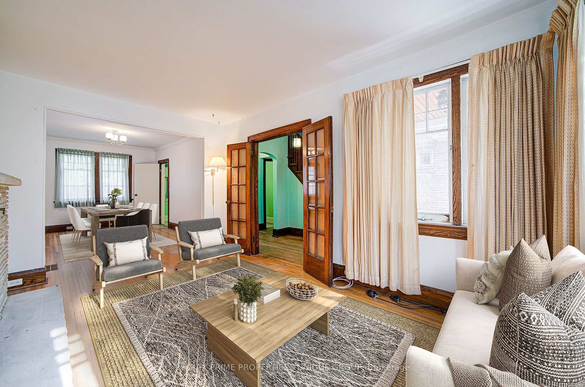 Living room with dining room in background.