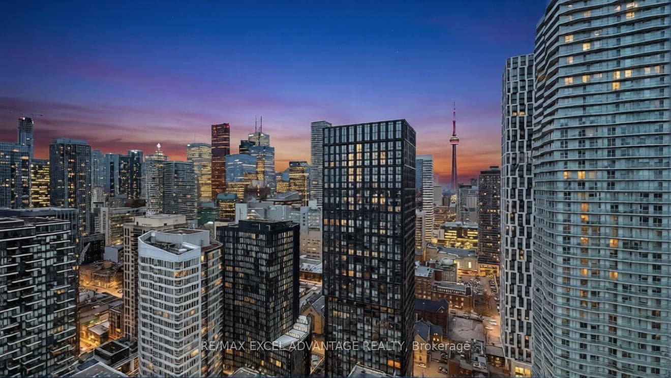 The city comes alive under a painted sky