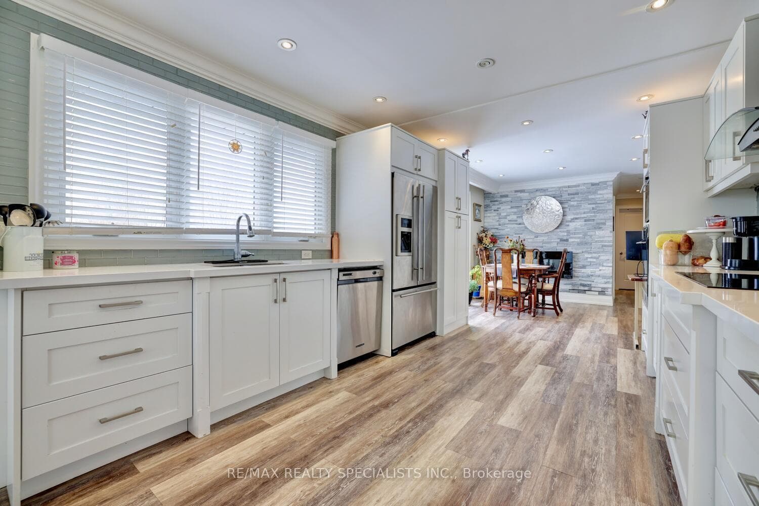 Vinyl floors, pantry, stainless steel appliances.