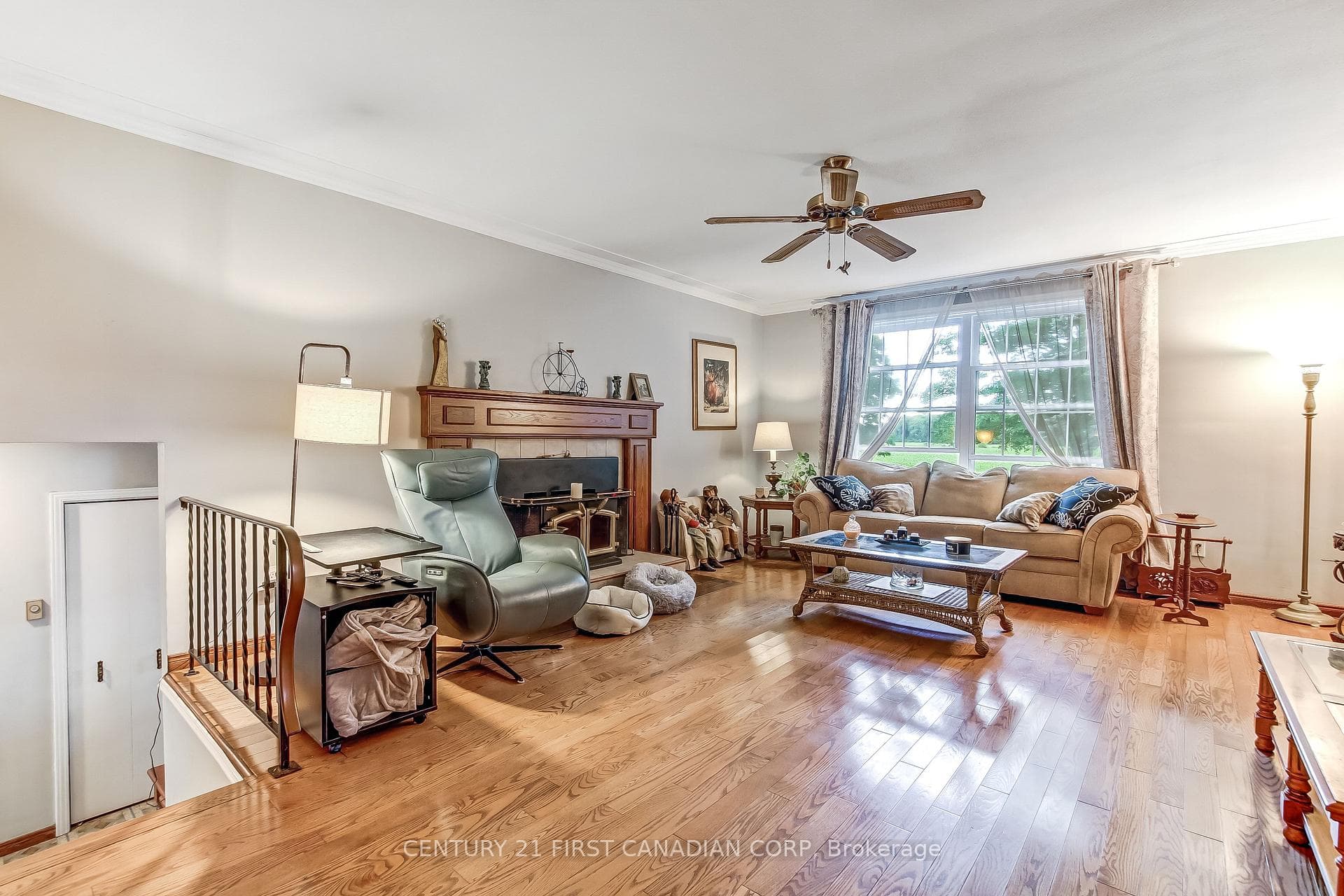 Hardwood floors and wood burning fireplace in LR