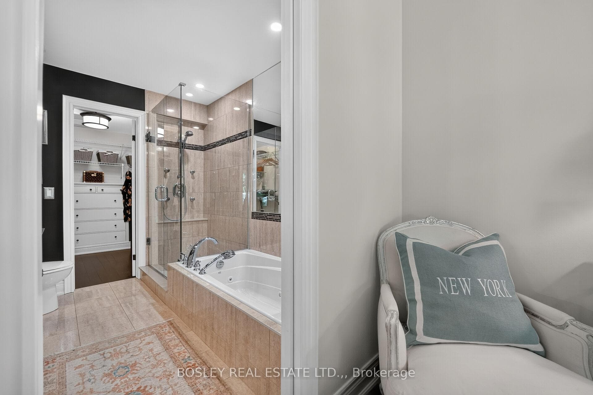 Spa ensuite features a soaking tub, glass shower,