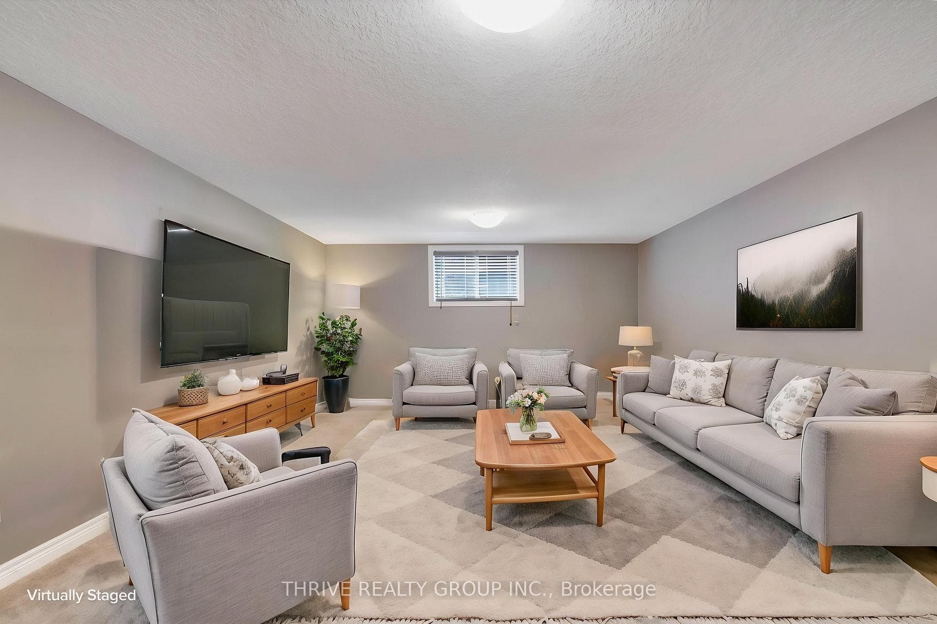 Virtually staged basement rec room