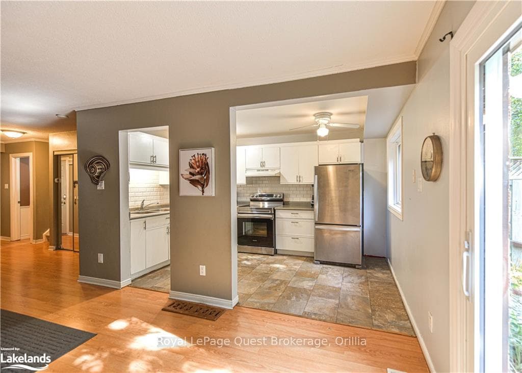 Kitchen with white cabinets, decorative backsplash