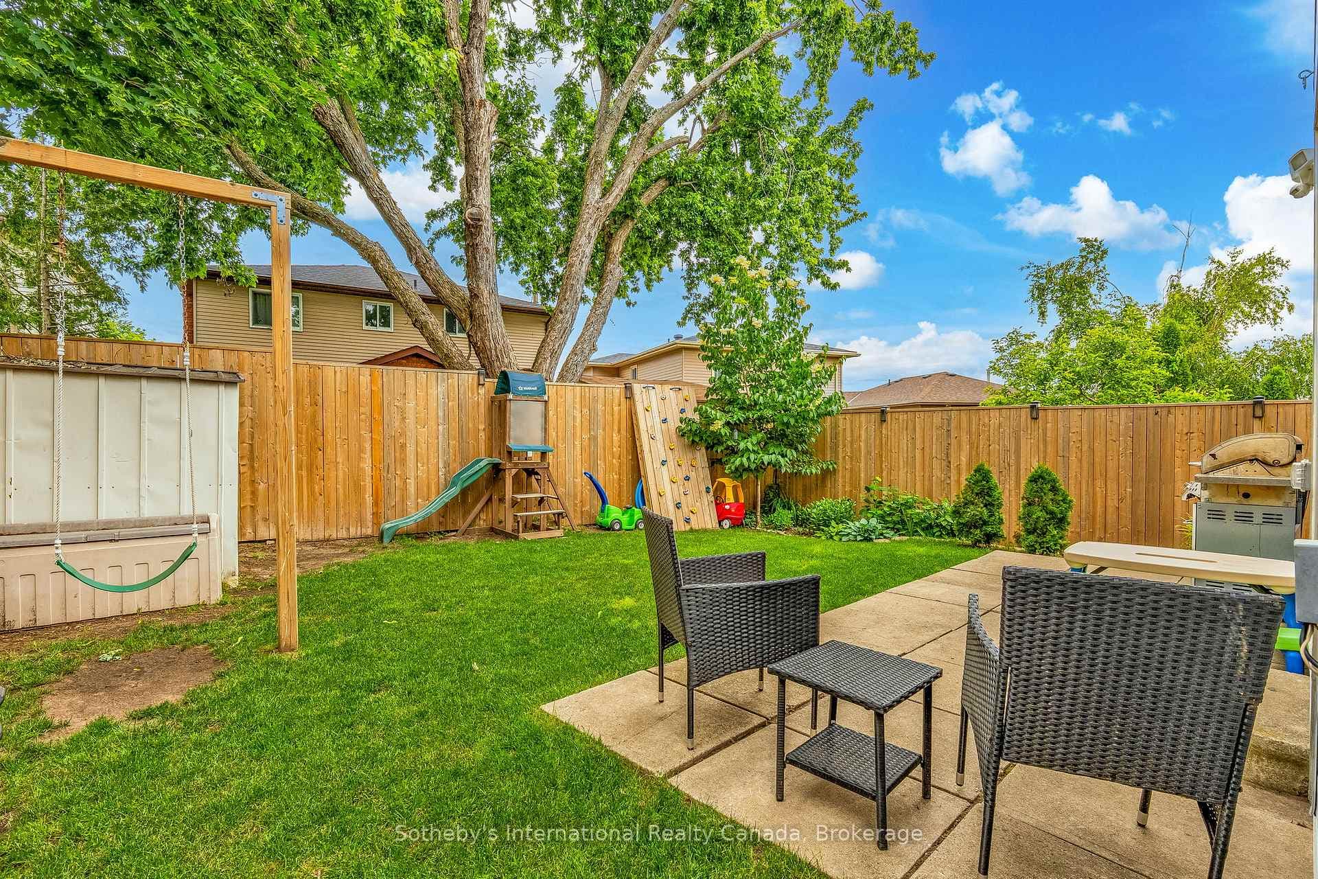 Fully fenced yard with patio.