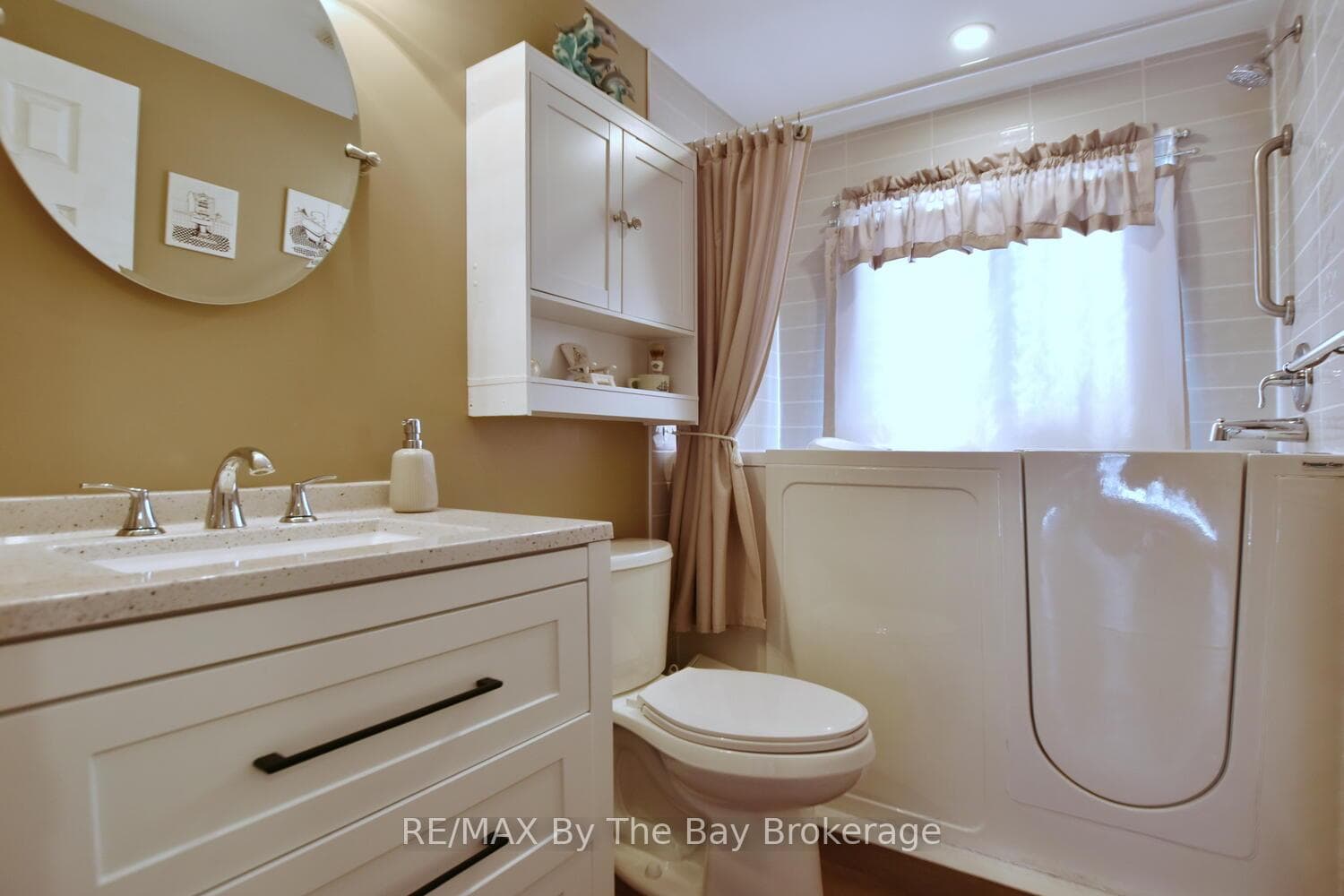 Updated Main 4 Piece Bathroom with Adapted Tub