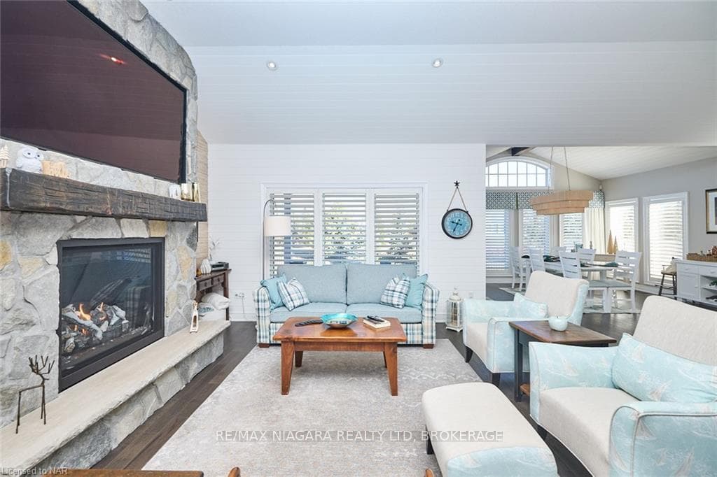 TV above Great Room Fireplace included