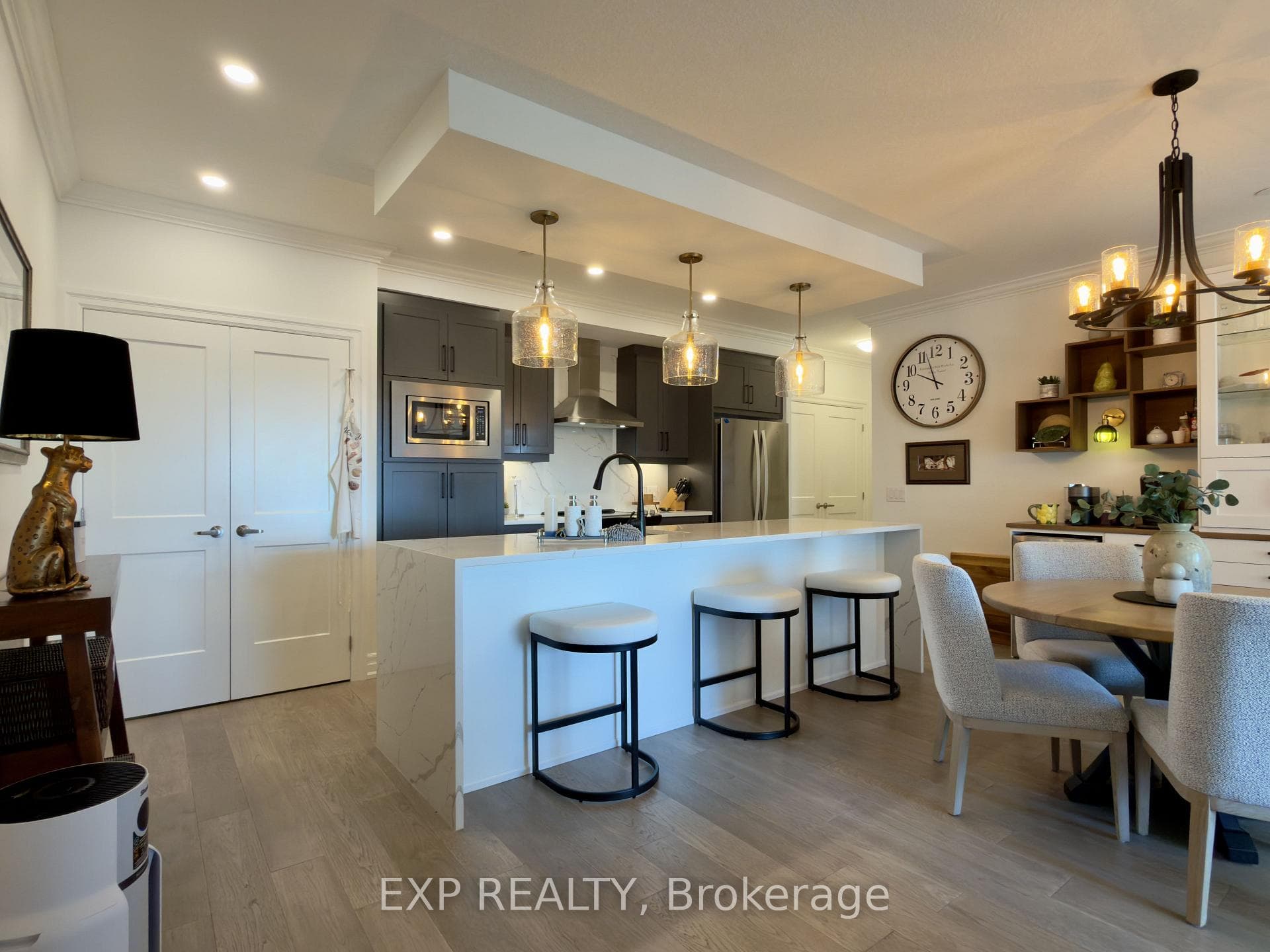 Dark cabinets and island seating.