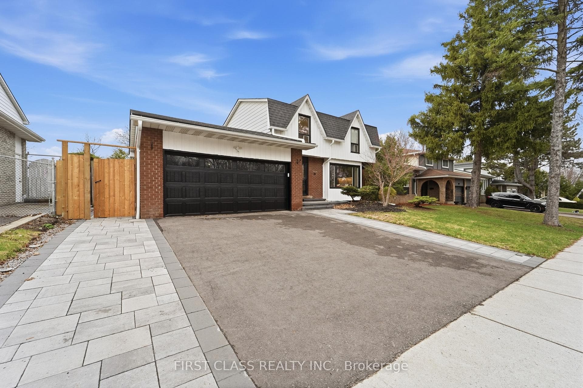 New asphalt driveway w/ interlocking stone walkway