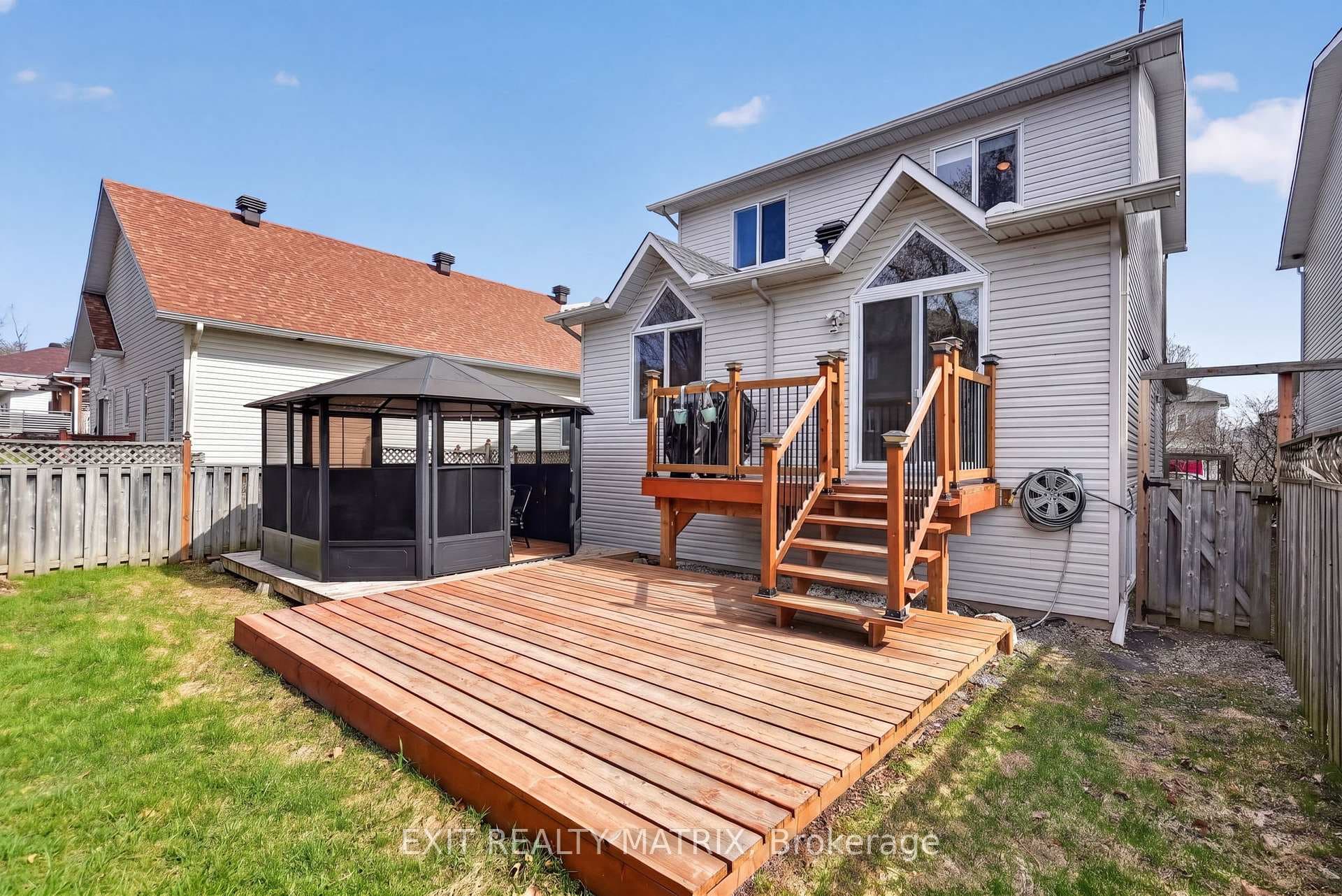 Fenced yard offers gazebo, shed & hot tub wiring
