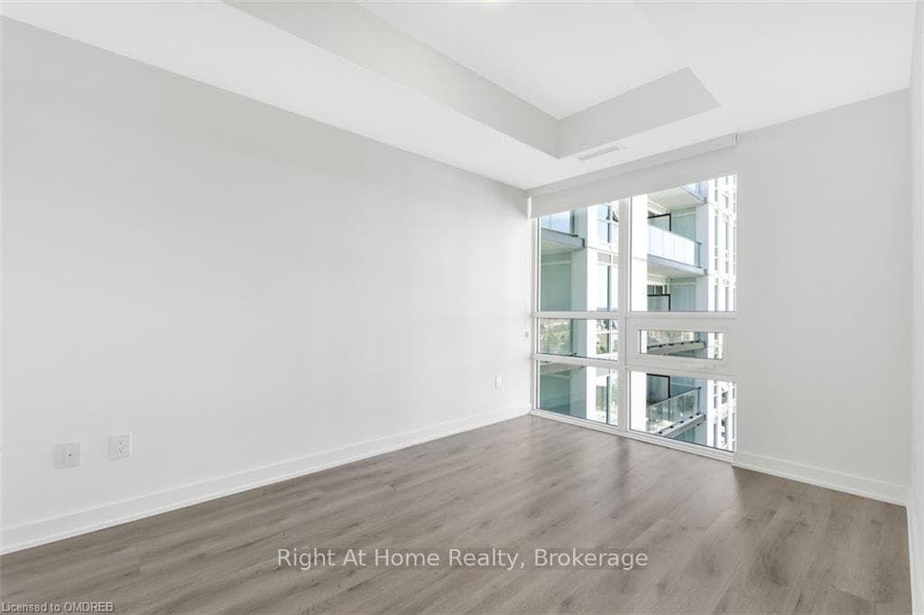 Empty room with hardwood / wood-style floors