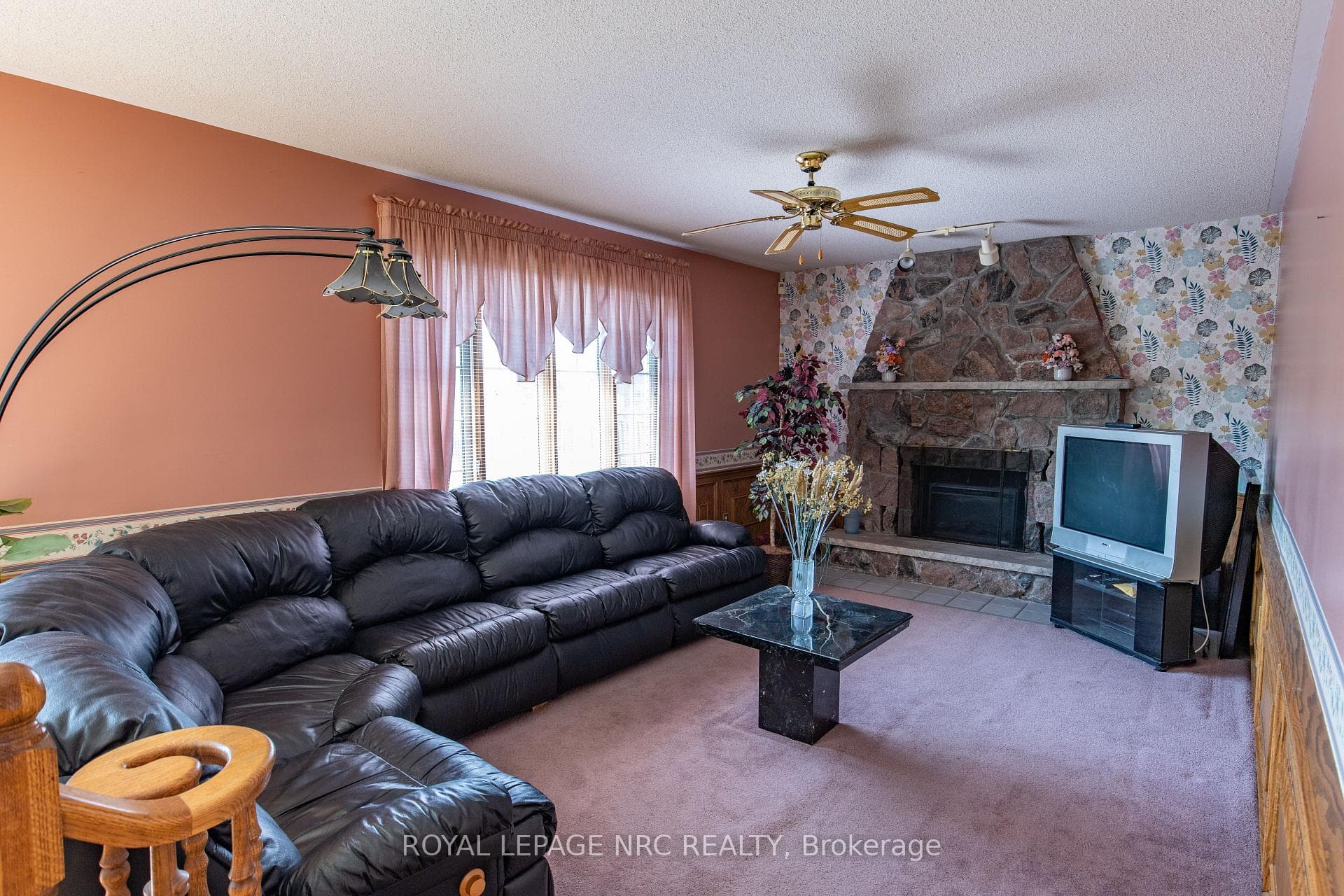 main floor family room with electric fireplace