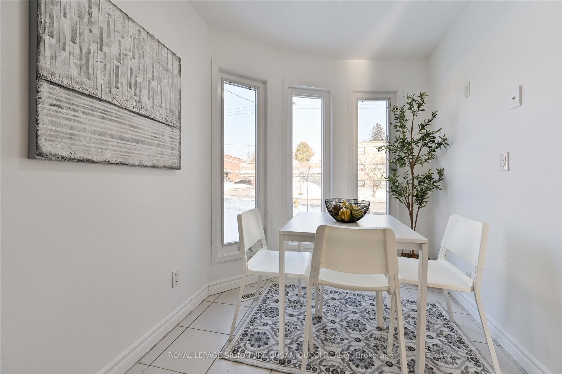 renovated kitchen features a bright bay window