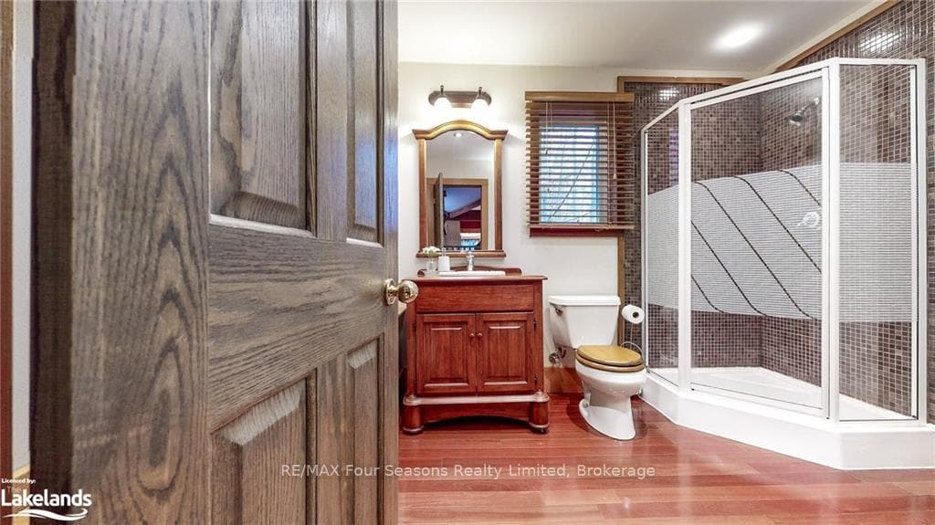 Bathroom featuring hardwood / wood-style flooring,