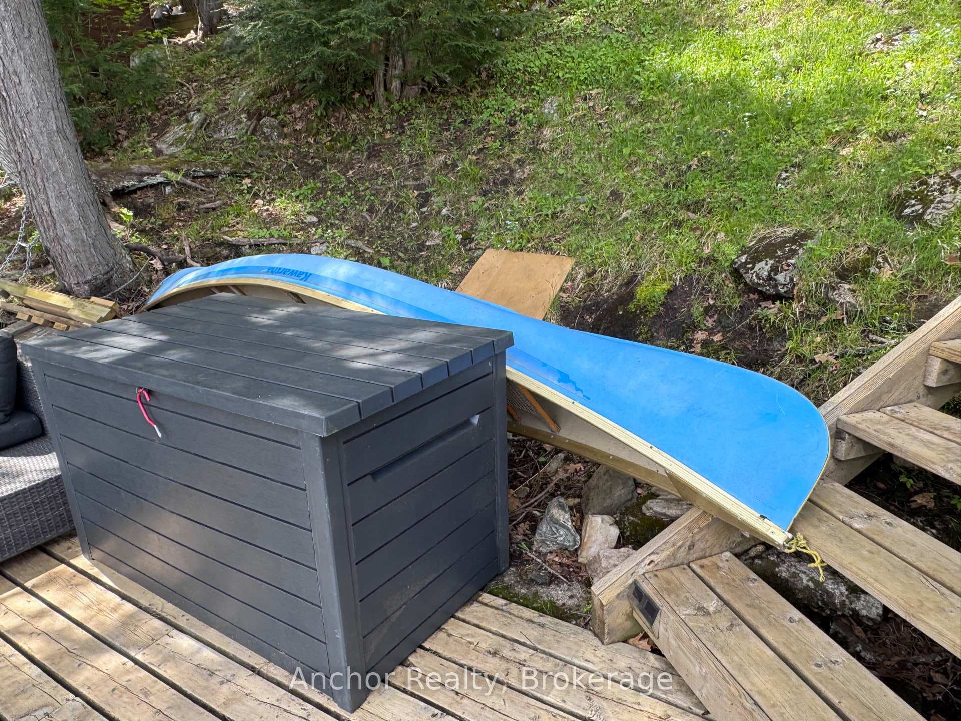 Canoe and storage bin