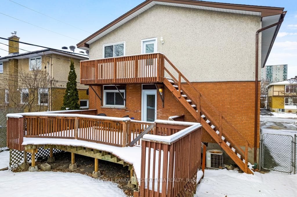 Upper apartment staircase to backyard and driveway