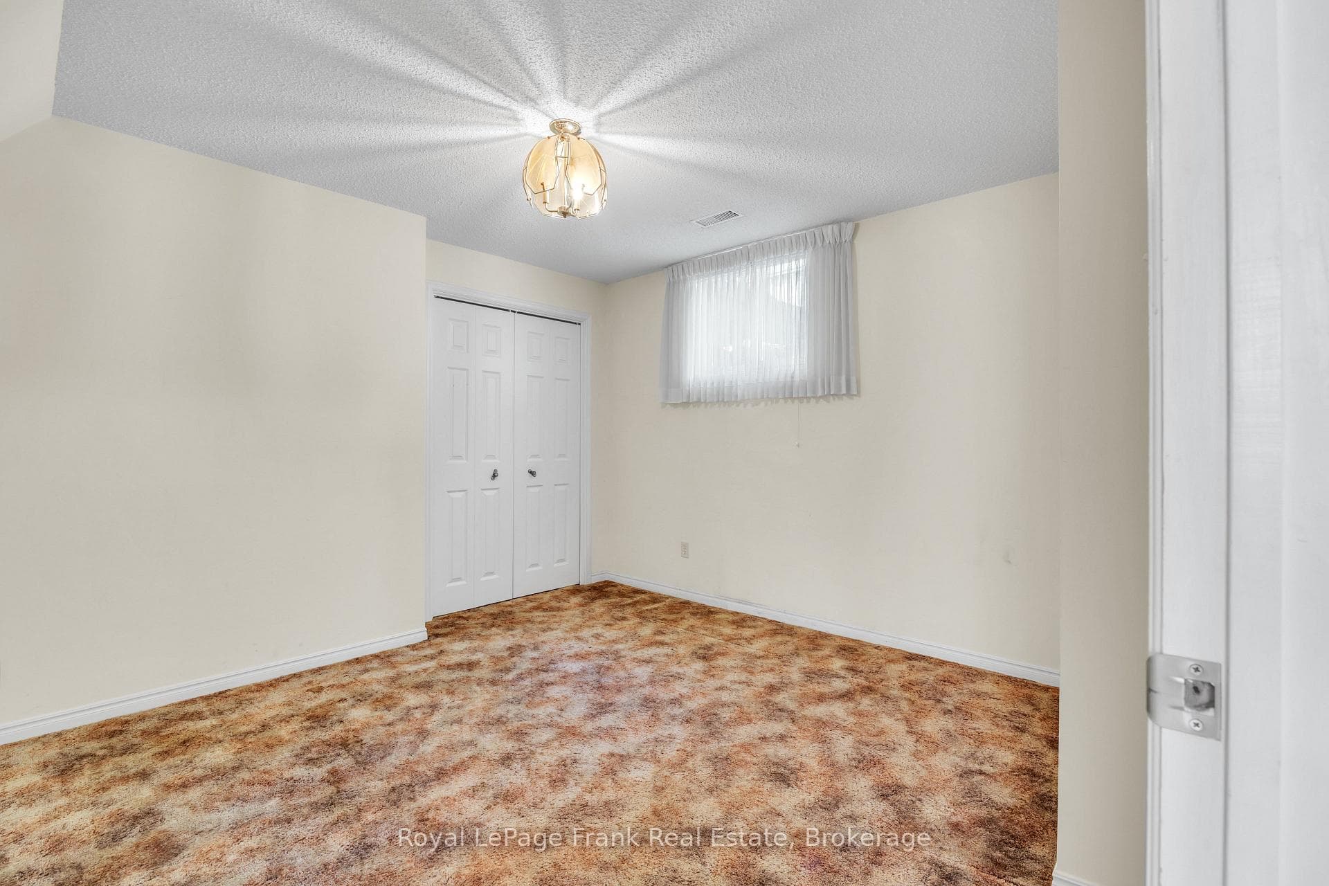 Lower level 3rd bedroom with abover grade window