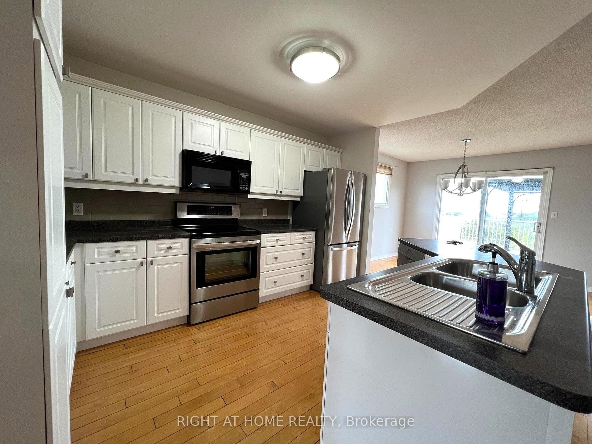 Large kitchen with stainless steel appliances