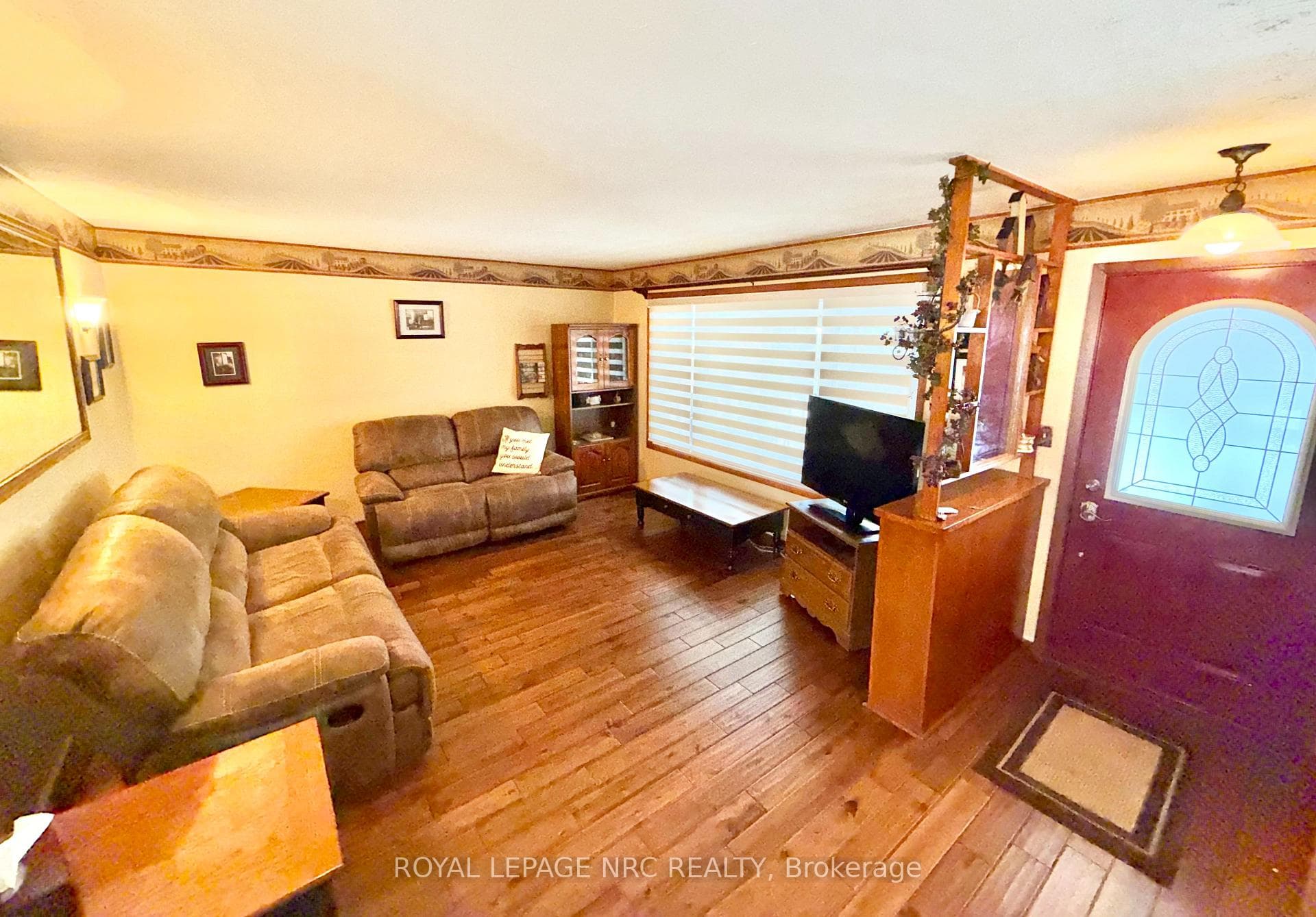 living room with convenient remote blinds