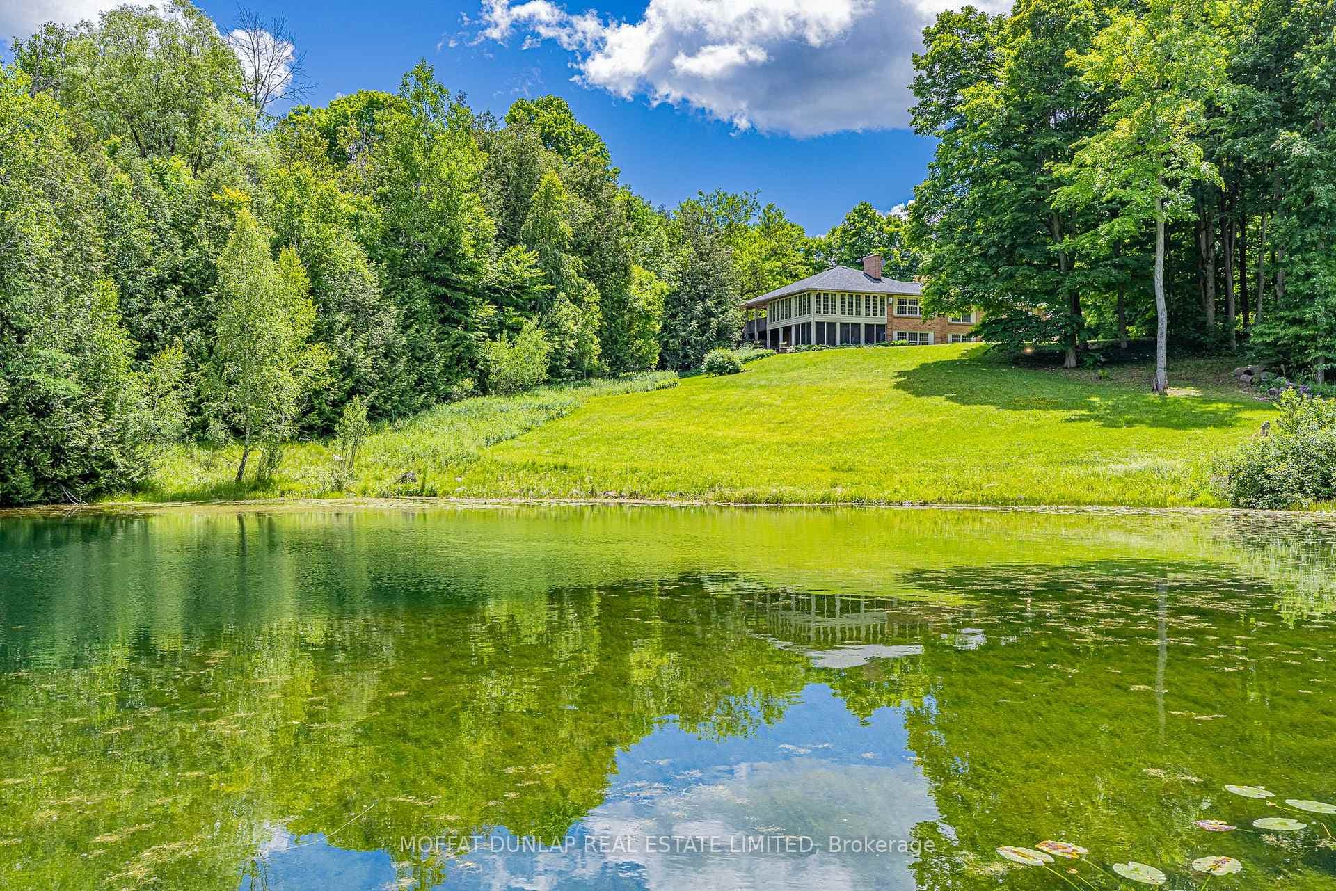 Walk-out bungalow overlooks pond