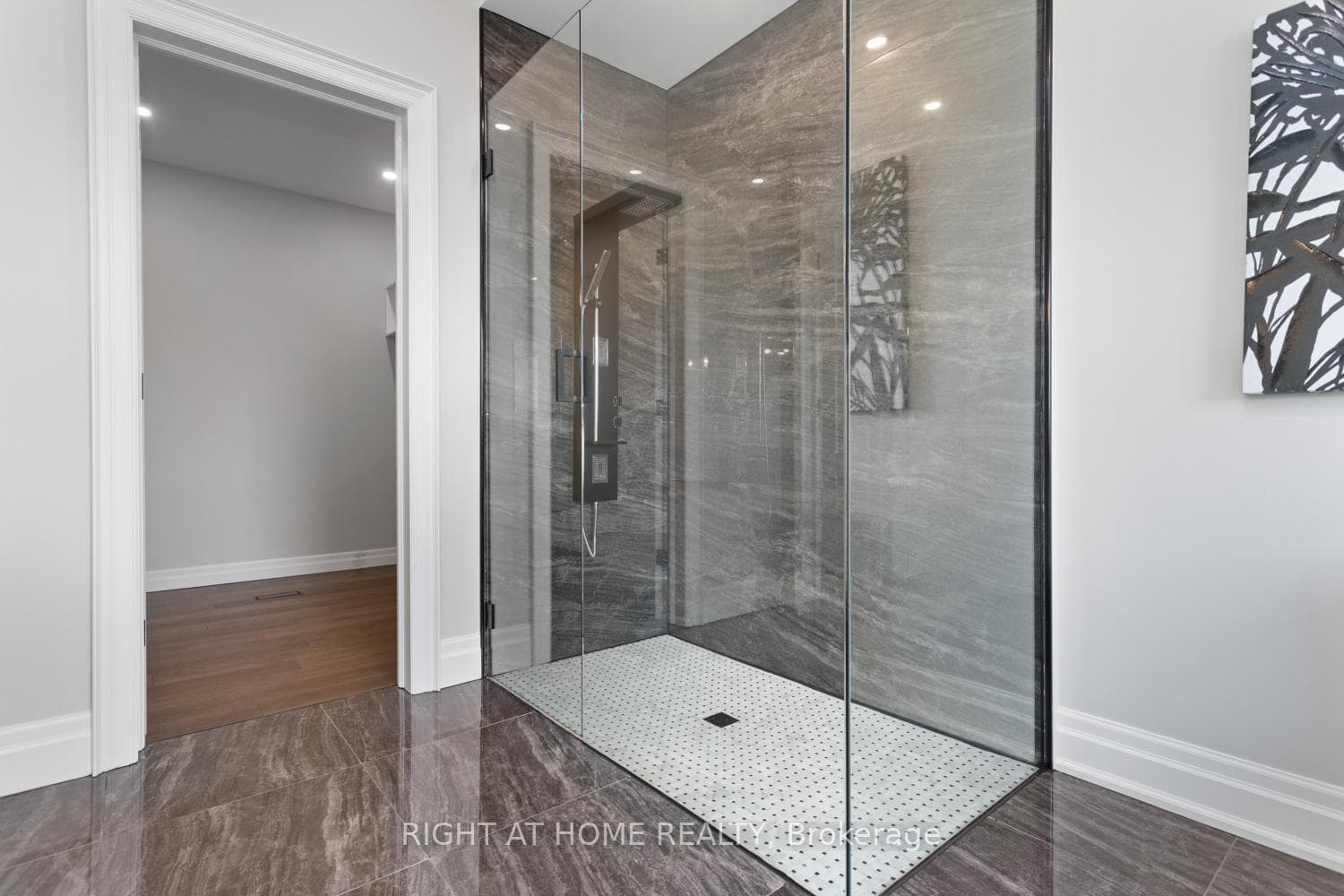 Glass enclosed zero curb shower