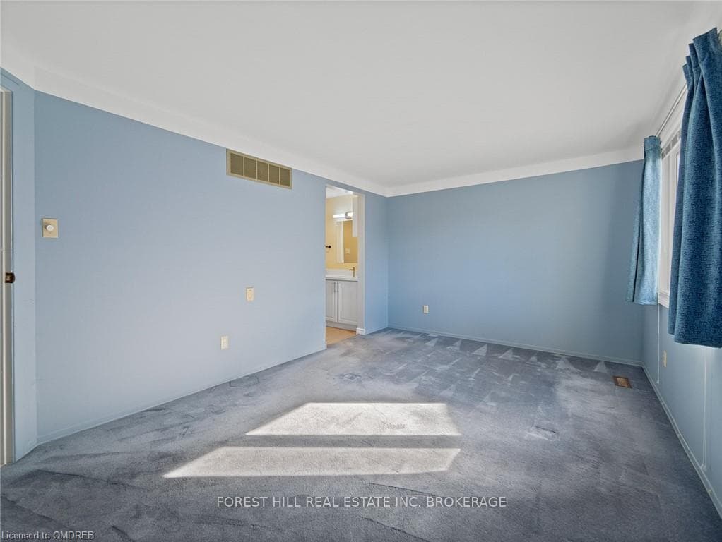 Empty room with carpet and ornamental molding