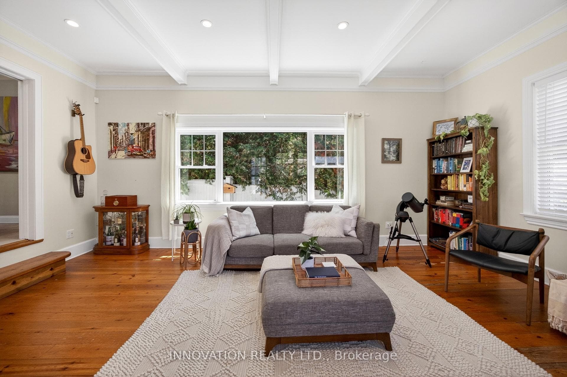 Family room with large windows to private yard
