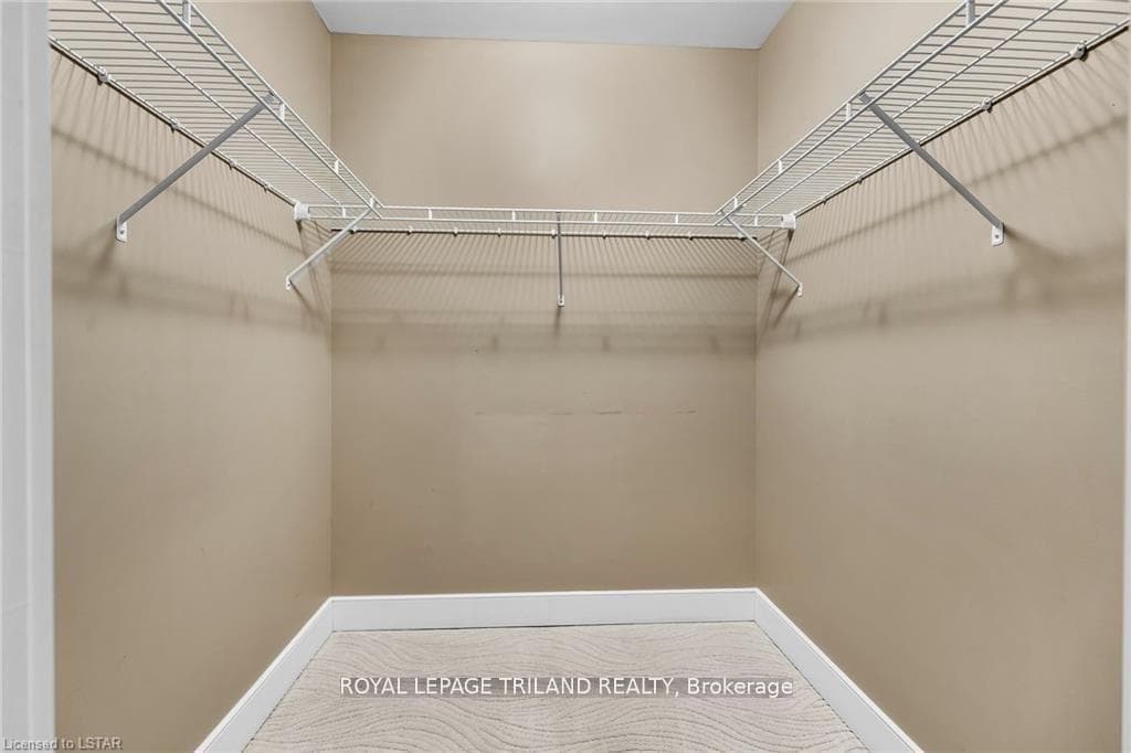 Primary bedroom walk-in closet
