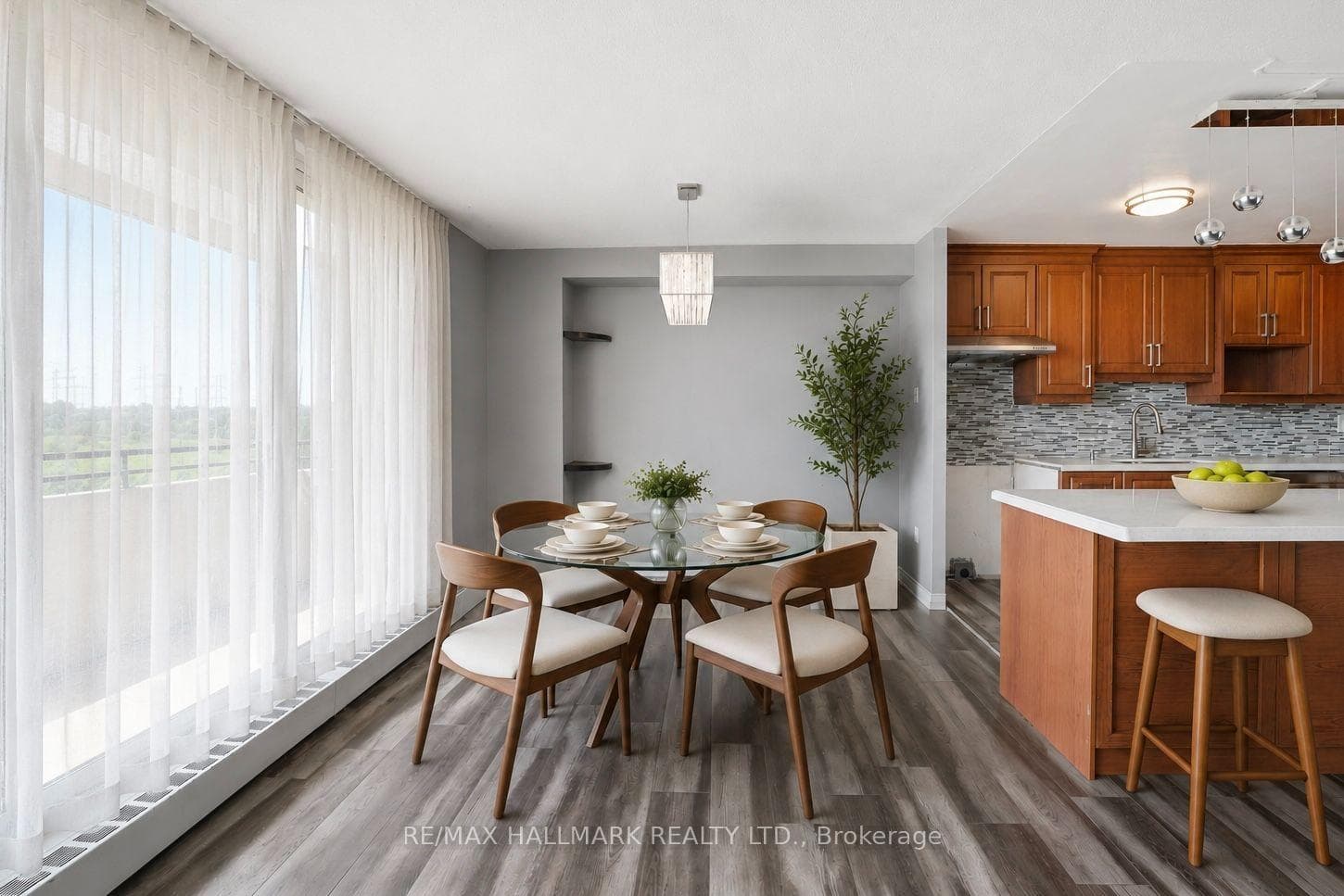 Dining Area with Access to Kitchen and Balcony
