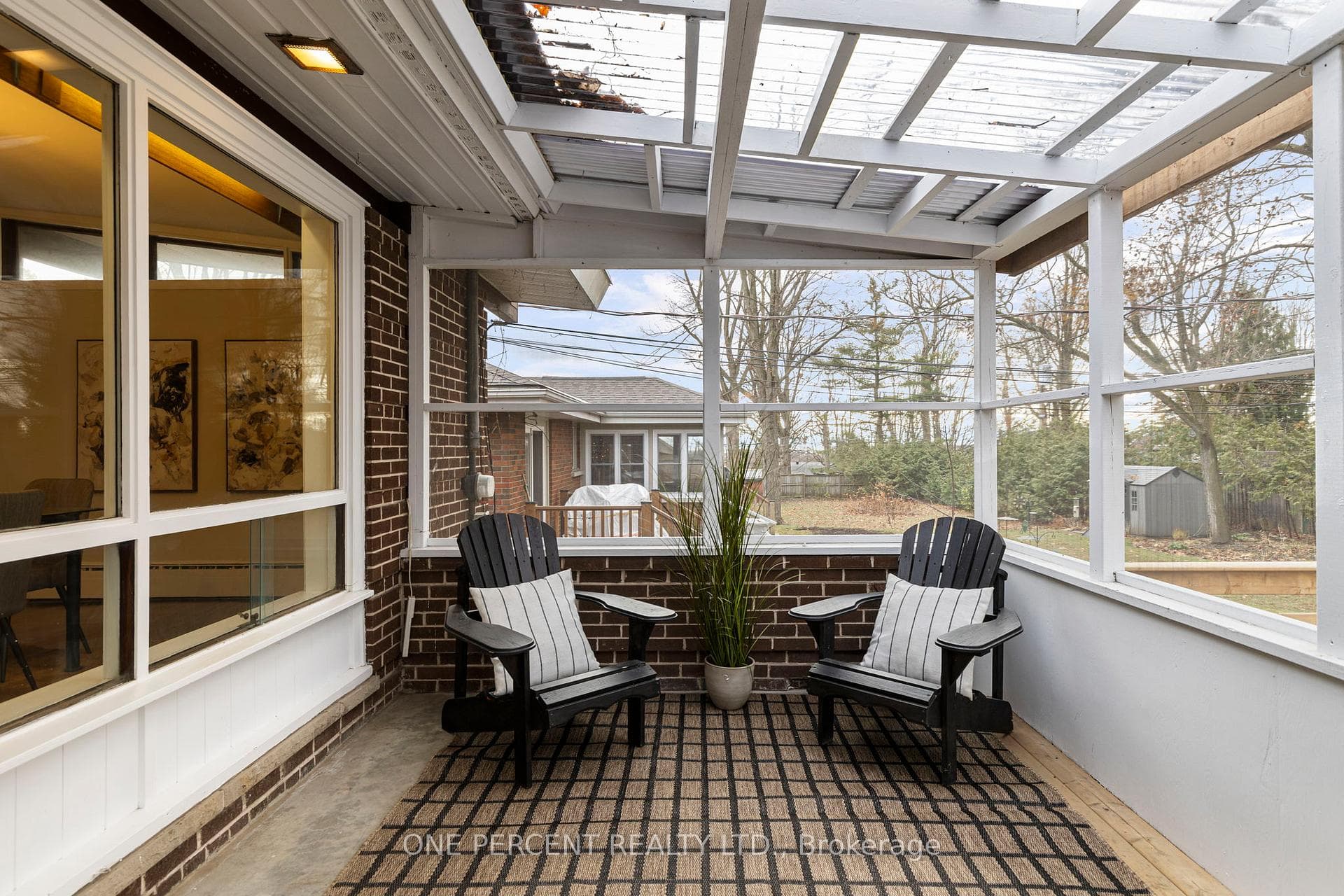 Screened-in sunroom off main floor dining room