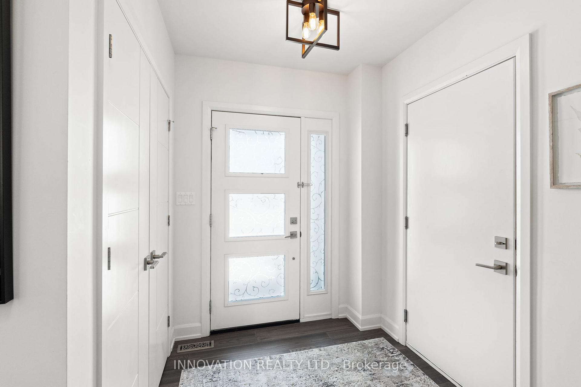 Front Entry with door to garage and coat closet.
