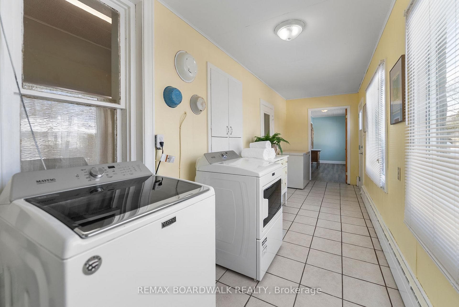 Look at this bright cheery laundry room!