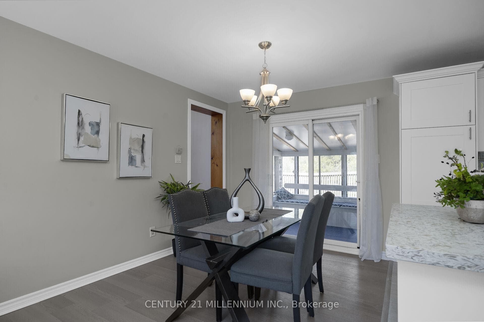 Dining area with walkout to sunroom
