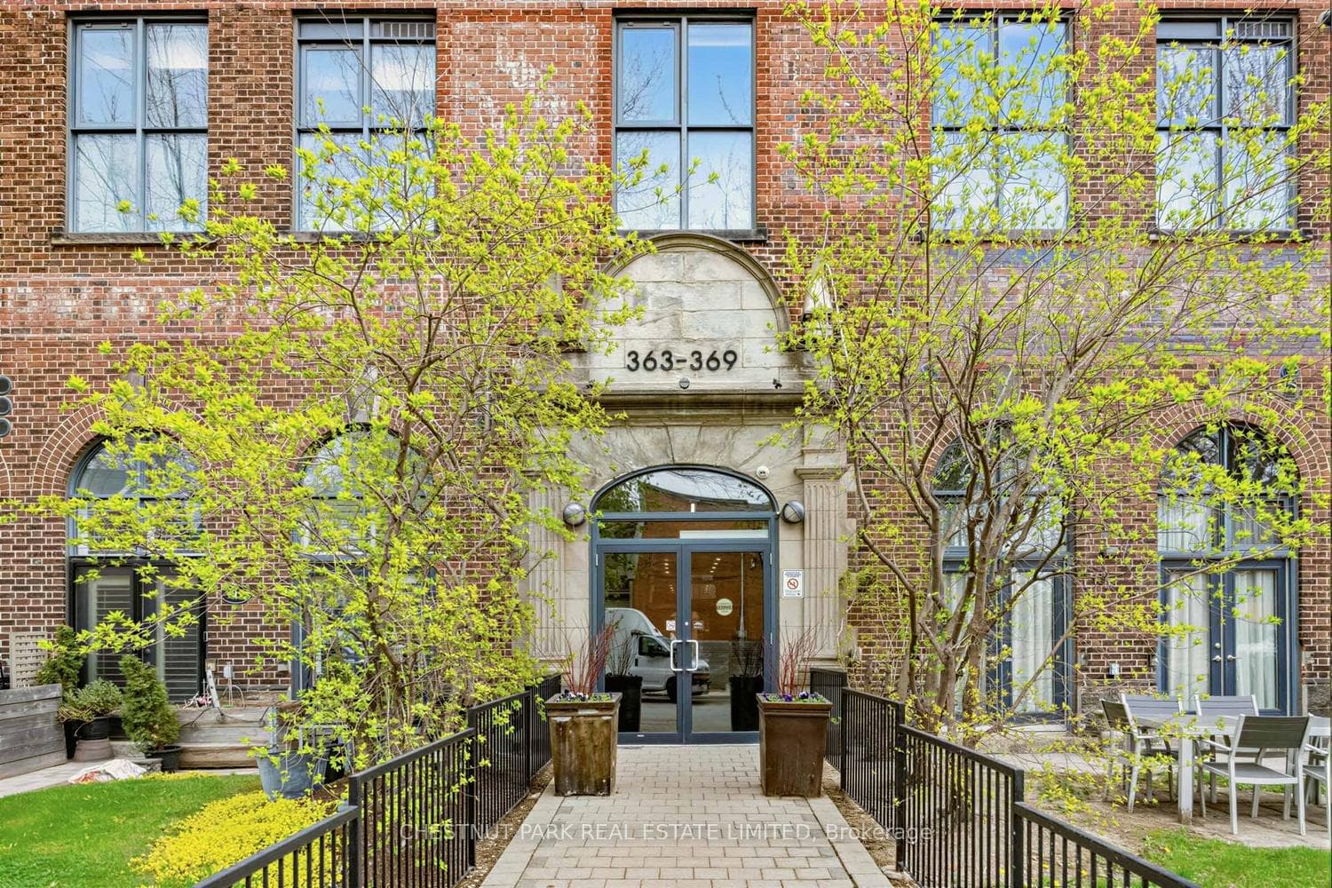 Landscaped entrance into spacious lobby