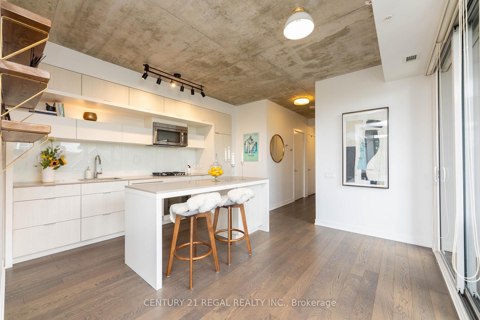 Kitchen overlooks sliding doors to terrace.
