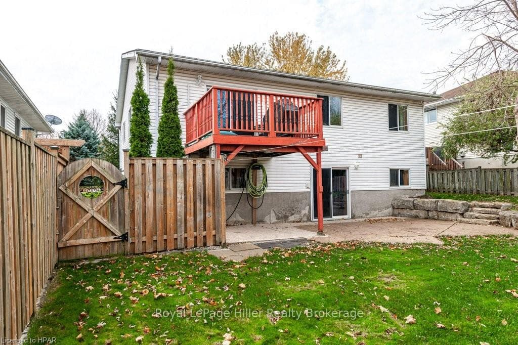 Rear view of property featuring a patio area and a