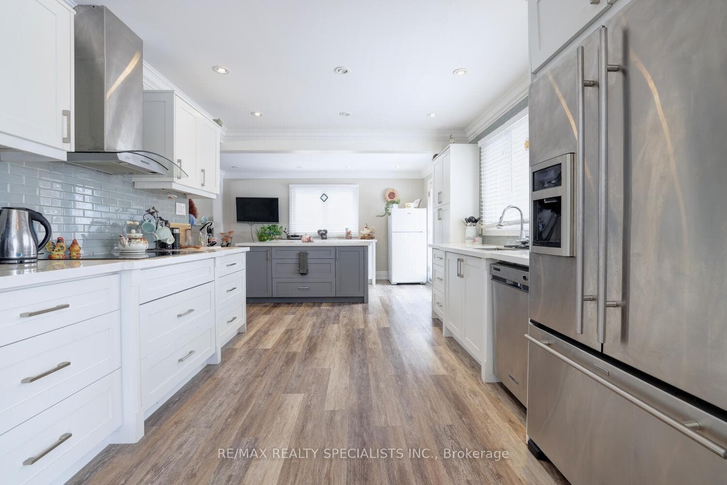 Modern kitchen with pantry, quartz countertops.