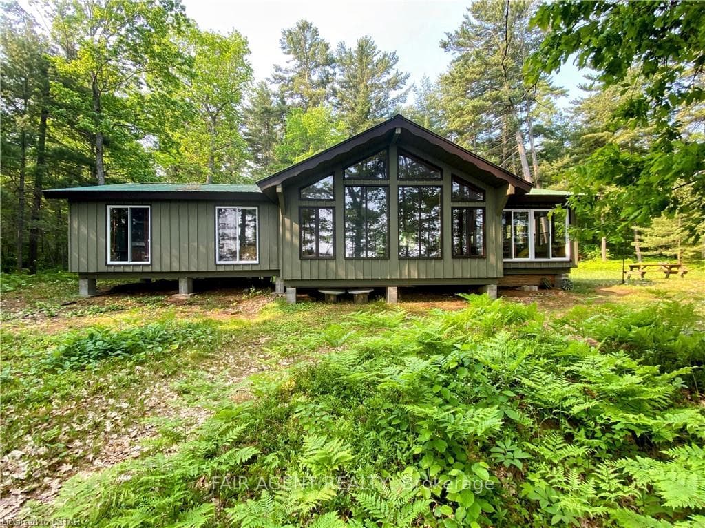 200 ft waterfront, sandy beach. Lake front luxury.