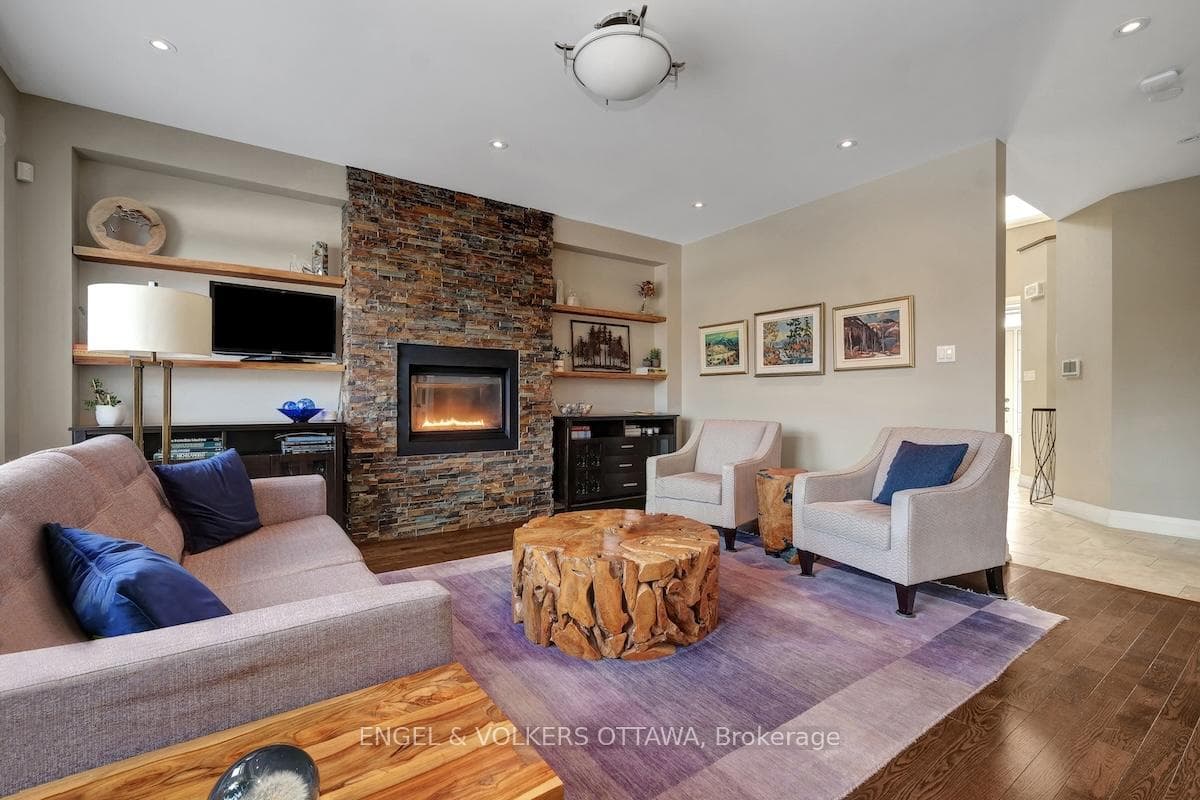 Living room with floating shelves and gas fireplac